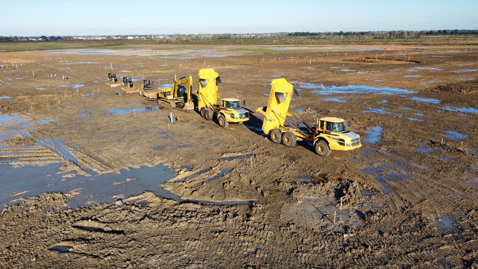 Heavy equipment fleet on active job site